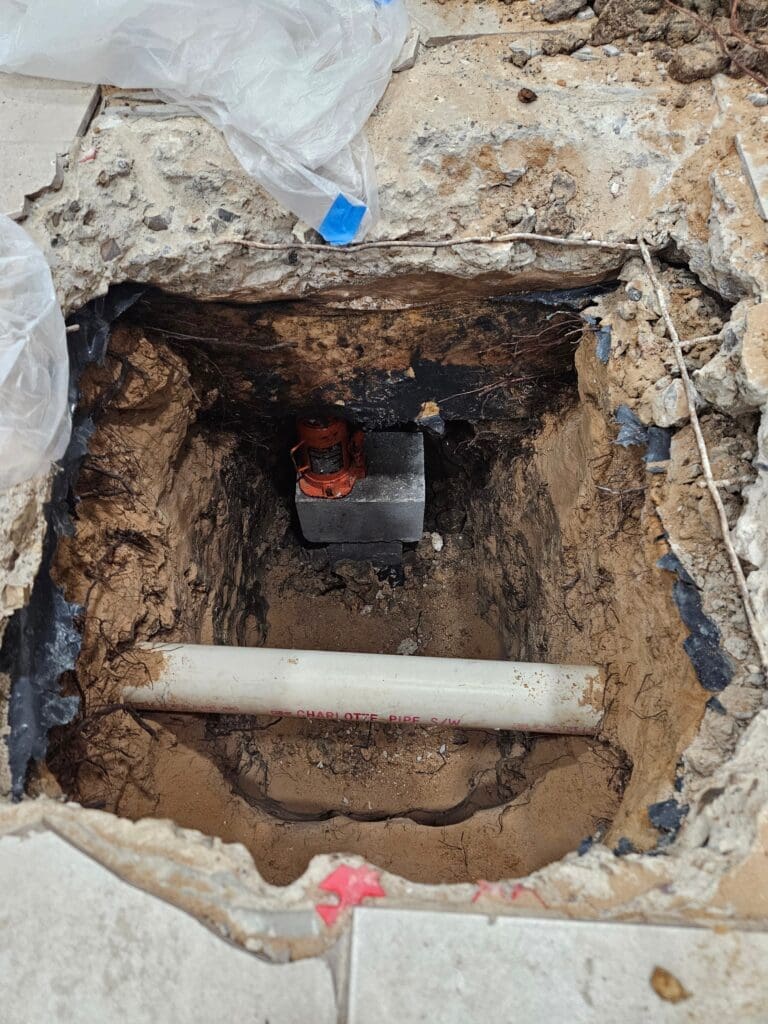 Interior piling holes by a top-rated Pearland Foundation repair company for concrete repair